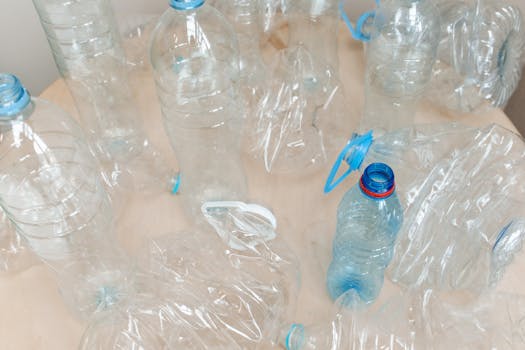 Clear Plastic Bottle on Brown Table