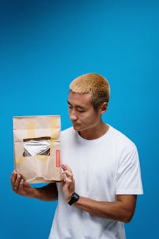 Man Holding Paper Bag